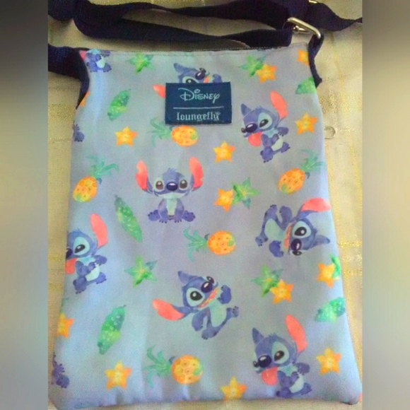 BNWOT LOUNGFLY SMALL CROSSBODY BLUE W/ GRAPHICS( DINT KNOW CHARACTER NAME) - Picture 1 of 4